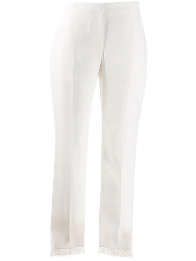 Shop Alexander Mcqueen Lace Hem Cropped Trousers In White