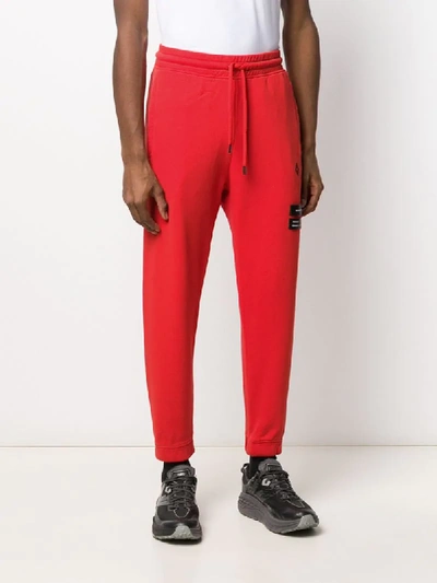 Shop Marcelo Burlon County Of Milan Relaxed-fit Cross Logo Track Pants In Red