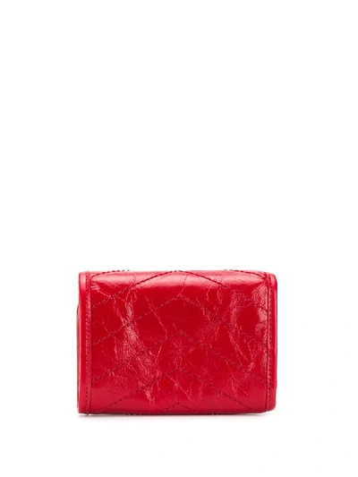 Shop Saint Laurent Niki Compact Tri-fold Wallet In Red