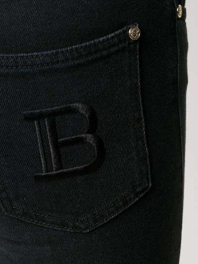 Shop Balmain B Monogram Skinny Jeans In Black