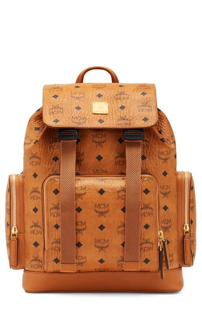 Shop Mcm Brandenburg Coated Canvas Backpack In Cognac