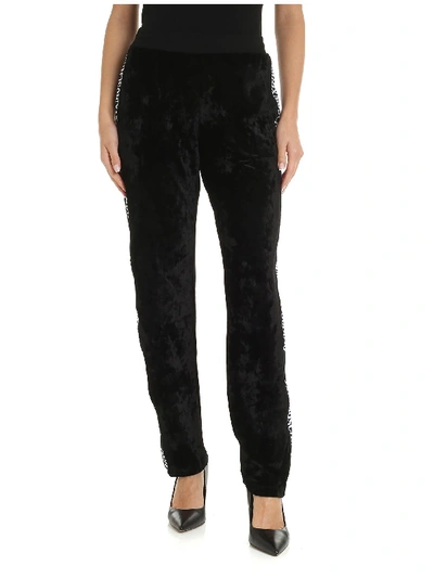 Shop Moschino Black Velvet Trousers With Branded Side Bands