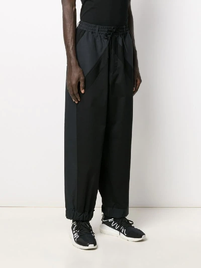 Shop Y-3 Wide-leg Track Pants In Black