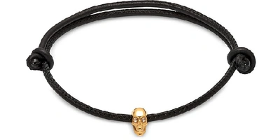 Shop Northskull Designer Men's Bracelets Atticus Skull Gold Plated Sterling Silver And Leather Cord Bracelet In Noir