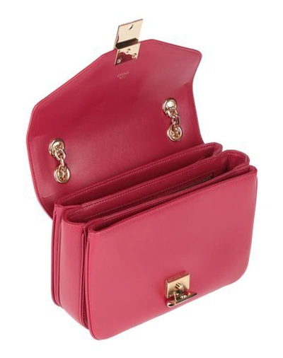 Shop Celine Handbags In Red