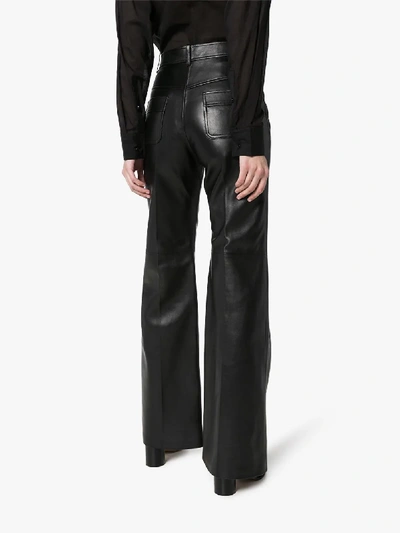 Shop Gucci Flared Leather Trousers In Black