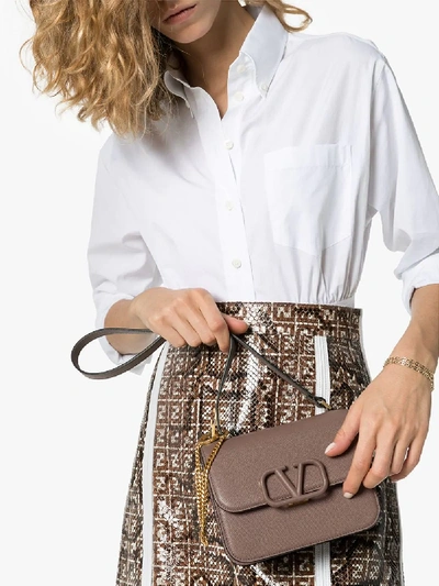 Shop Valentino Womens Grey Brown Garavani Sling Logo Leather Shoulder Bag