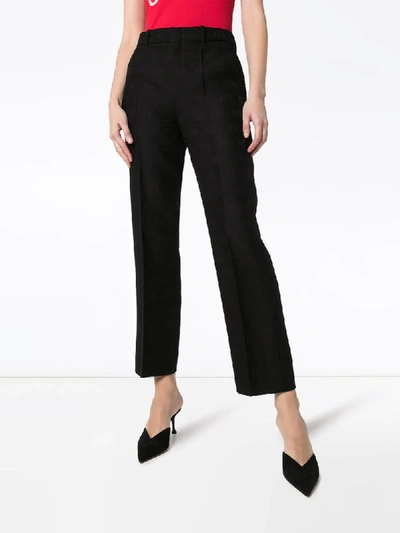 Shop Gucci Gg-embroidered Wool And Silk-blend Slim-fit Trousers In Black