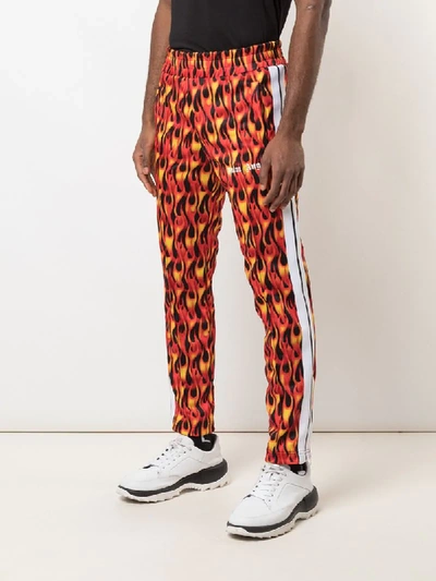 Shop Palm Angels Flame Print Track Pants In Red