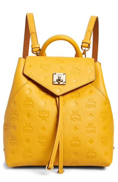 Shop Mcm Essential Monogram Leather Small Backpack - Yellow In Golden Mango