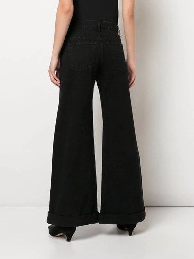 Shop Khaite Noelle Wide-leg Jeans In Black