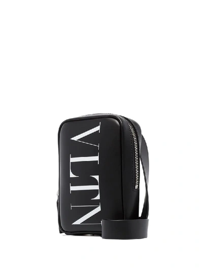 Shop Valentino Vltn Logo Crossbody Bag In Black