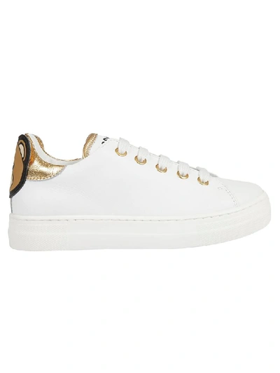 Shop Moschino Logo Print Sneakers In White/gold