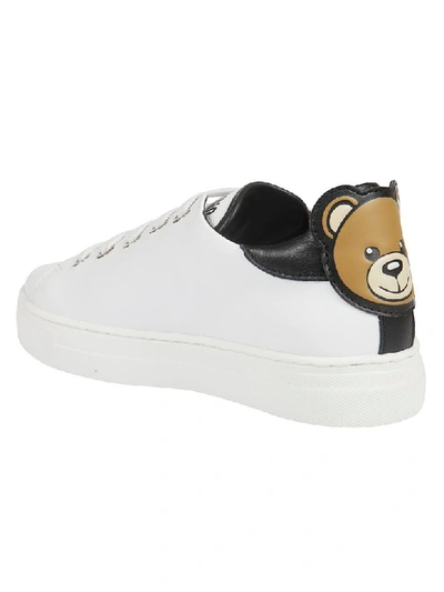 Shop Moschino Logo Print Sneakers In White/black