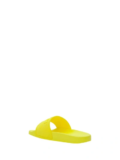 Shop Gucci Logo Rubber Slide Sandal In Giallo