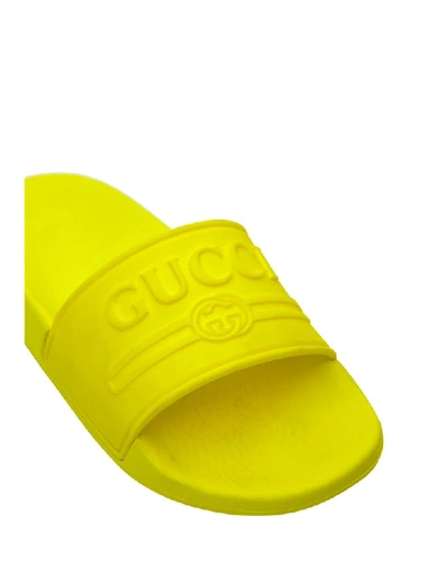 Shop Gucci Logo Rubber Slide Sandal In Giallo