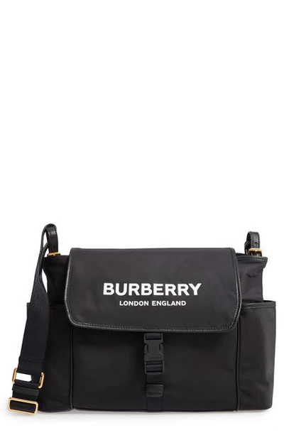 Shop Burberry Flap Nylon Diaper Bag In Black