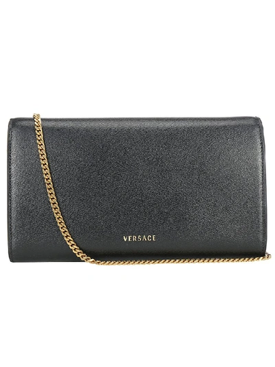 Shop Versace Embellished Medusa Clutch Bag In Black