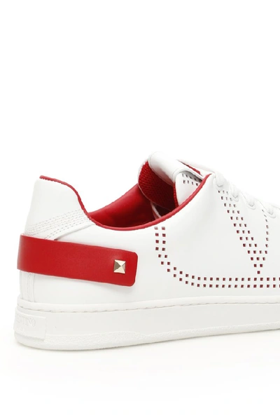 Shop Valentino Garavani Vlogo Studded Sneakers In Multi