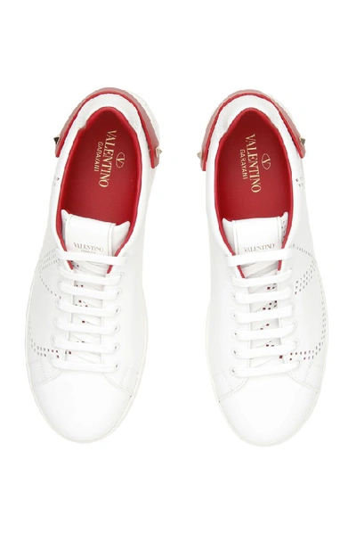 Shop Valentino Garavani Vlogo Studded Sneakers In Multi