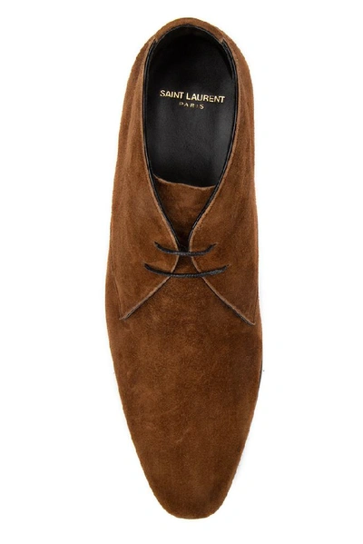 Shop Saint Laurent Wyatt Ankle Boots In Brown