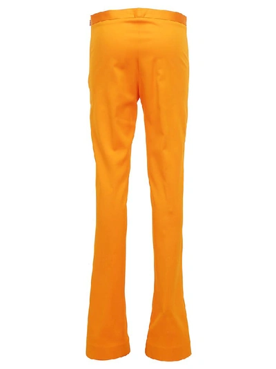 Shop Versace Flared Pants In Orange