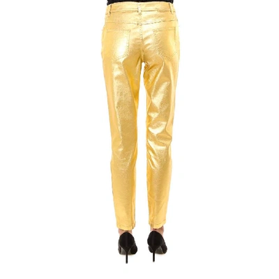 Shop Moschino Smeared Effect Slim Fit Trousers In Gold