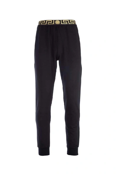 Shop Versace Greca Trackpants In Black