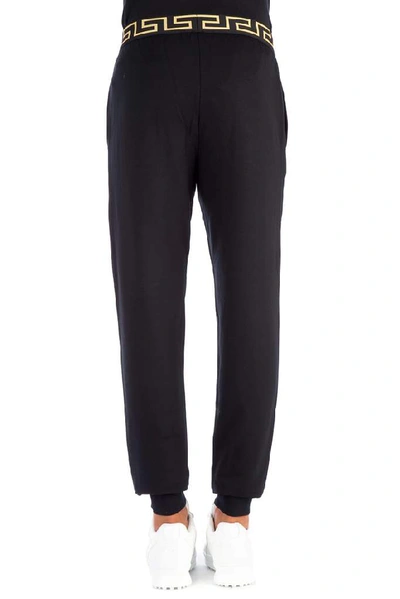 Shop Versace Greca Trackpants In Black