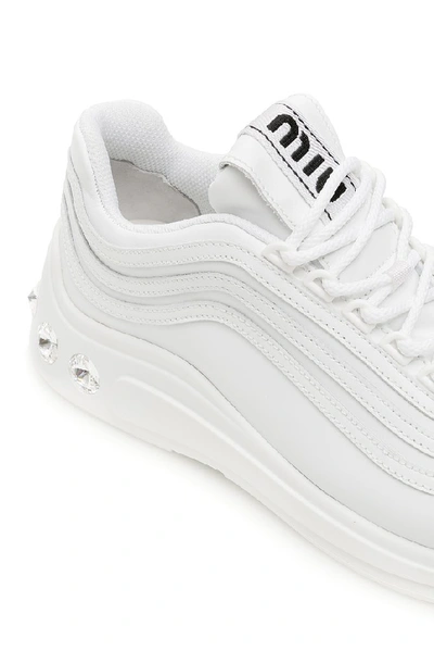 Shop Miu Miu Crystal Embellished Low Top Sneakers In White
