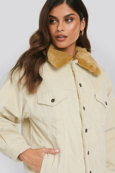 Shop Levi's Oversized Cord Fur Trucker Jacket White In Ecru Wide Wale