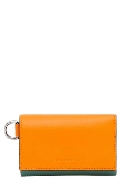 Shop Burberry Finn Colorblock Folding Leather Wallet In Orange/ Green