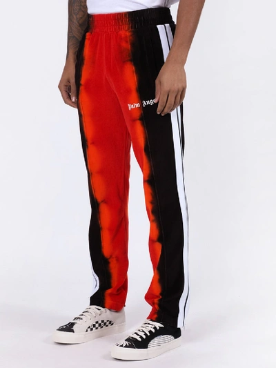 Shop Palm Angels Tie-dye Track Pants Red