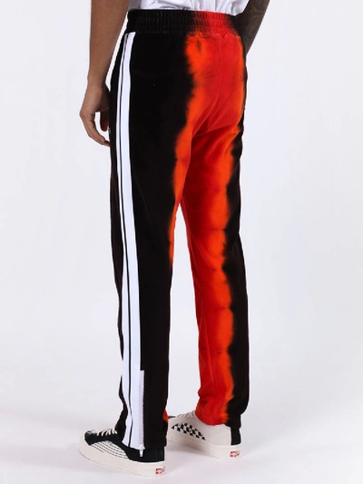 Shop Palm Angels Tie-dye Track Pants Red