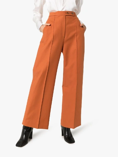 Shop Khaite Yasmin Wide Leg Trousers In Orange