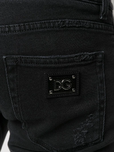 Shop Dolce & Gabbana Distressed Slim-fit Jeans In Black