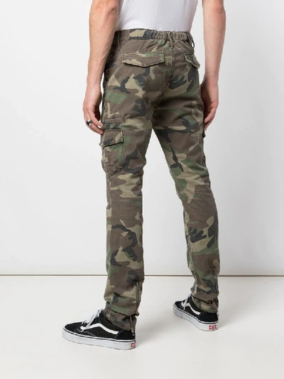 Shop Rta Camouflage Print Trousers In Green