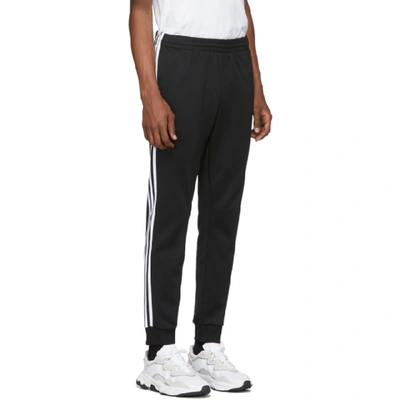 Shop Adidas Originals Black Sst Track Pants