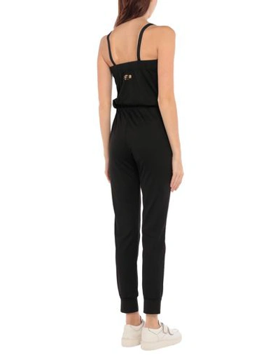 Shop Moschino Jumpsuit/one Piece In Black