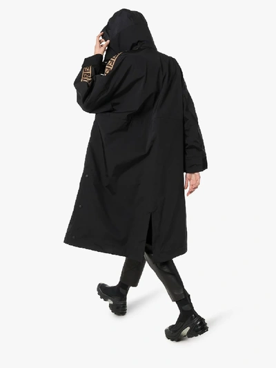 Shop Fendi Logo Tape Parka Coat In Black