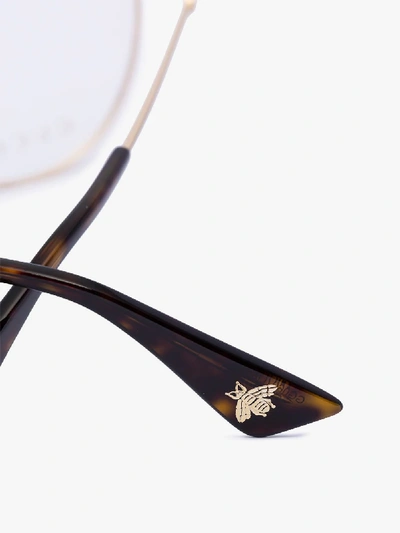 Shop Gucci Gold Tone Round Optical Glasses