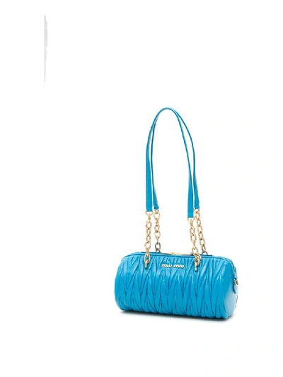 Shop Miu Miu Matelasse Cylinder Bag In Voyage (light Blue)