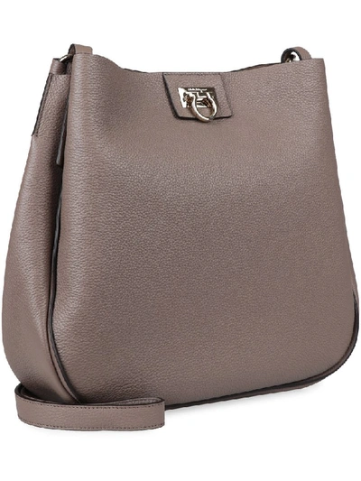 Shop Ferragamo Hobo Pebbled Leather Messenger Bag In Turtledove