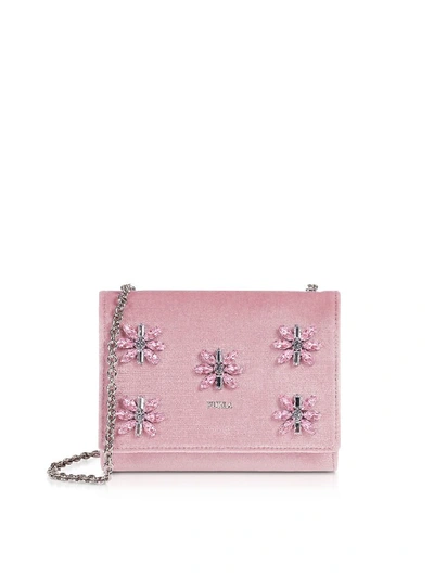 Furla Viva Mini Pochette crafted in Suede with crystal floral  embellishments plays on the timelessness of the chain bag with a sliding  strap that goes from shoulder to crossbody. Featuring flap top