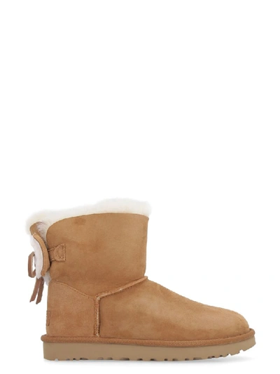 Shop Ugg Classic Double Bow Mini Suede Ankle Boots In Camel