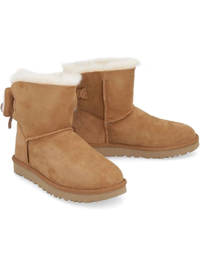 Shop Ugg Classic Double Bow Mini Suede Ankle Boots In Camel