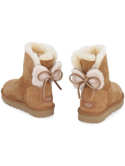 Shop Ugg Classic Double Bow Mini Suede Ankle Boots In Camel