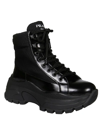 Shop Prada Logo Lace-up Boots In Black