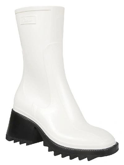 Shop Chloé Spike Sole High Ankle Boots In White