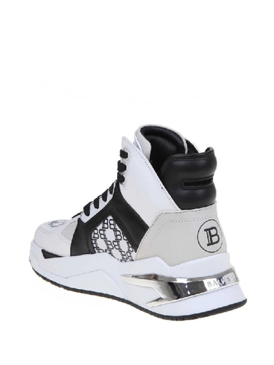 Shop Balmain B-ball Sneakers In White / Black Leather In White/black
